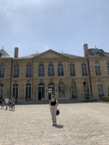 A person in front of a building.