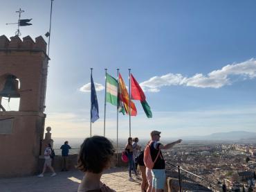 View of Granada, Spain with people and flags