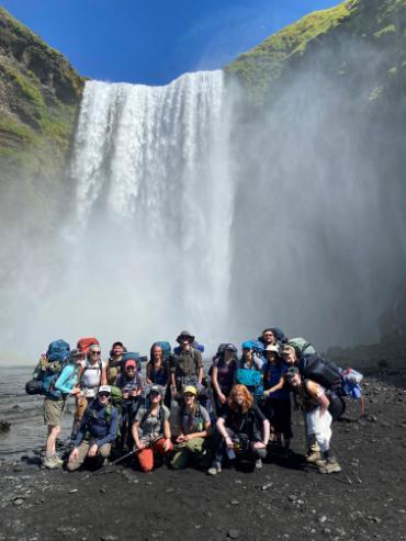 Group in front of waterfall.