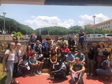 group of students sitting on stairs