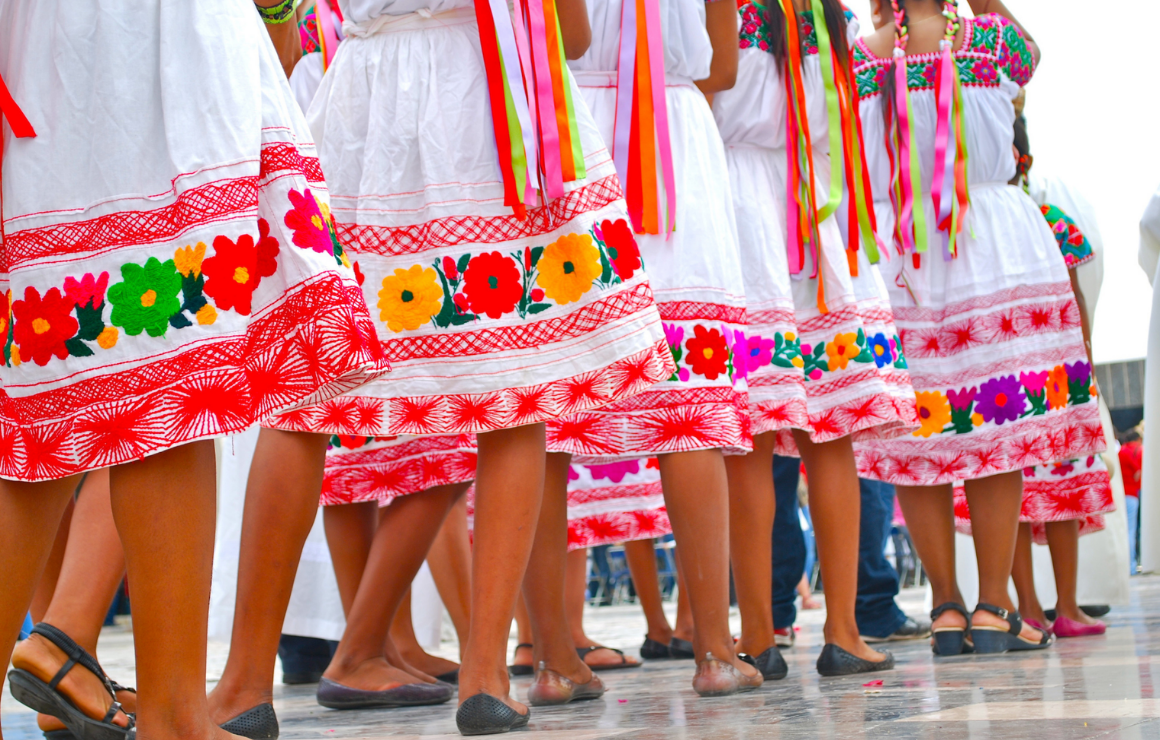 colorful floral skirts of traditional Mexican dancers