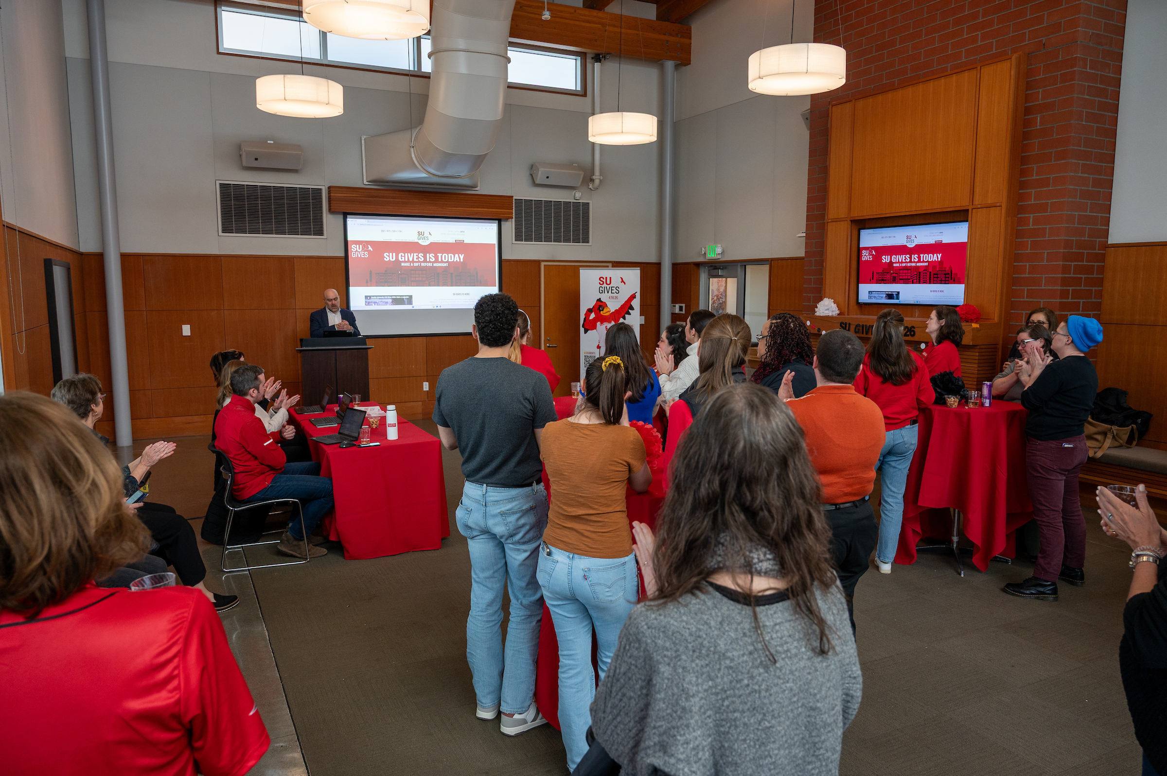 people watching an SU Gives presentation