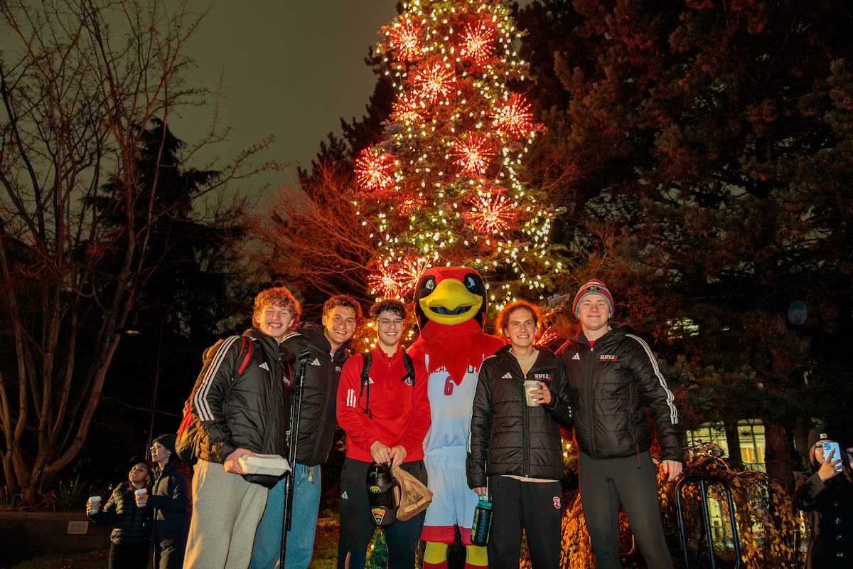 Tree lighting students and rudy