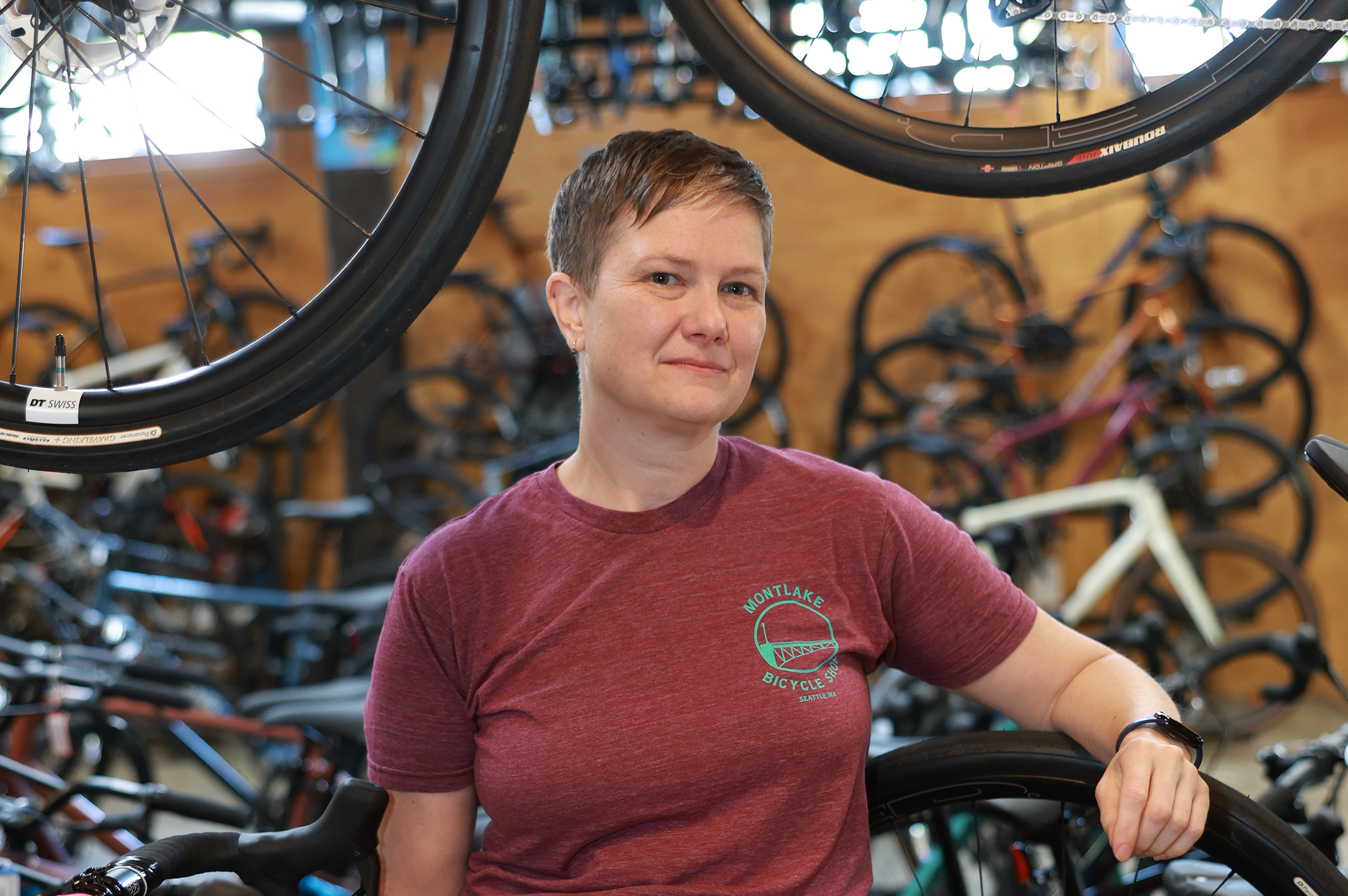 A portrait of Carolyn Eaton in front of bicycles